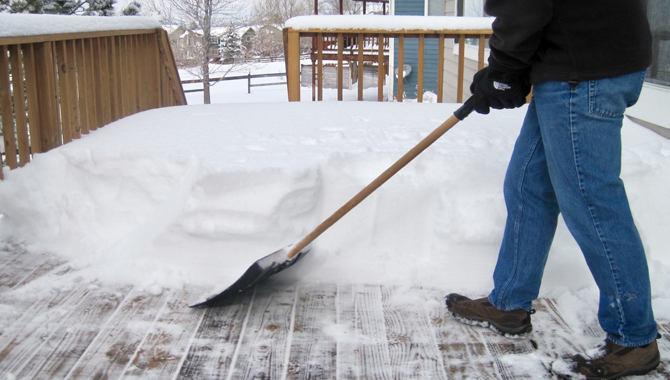 By Shoveling Snow from Deck Wood