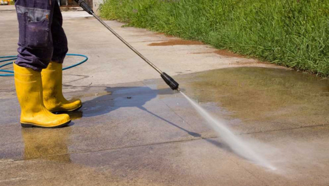 By Using a Pressure Washer