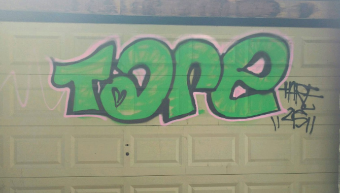Remove Graffiti From A Garage Door: