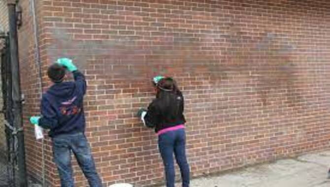 Remove Graffiti from a brick wall, masonry surface, or stone facade