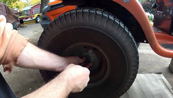 To Remove The Back Wheel From A Riding Lawn Mower.