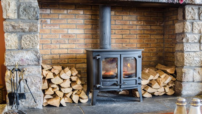 Use A Fireplace Or Stove To Dry The Wood.